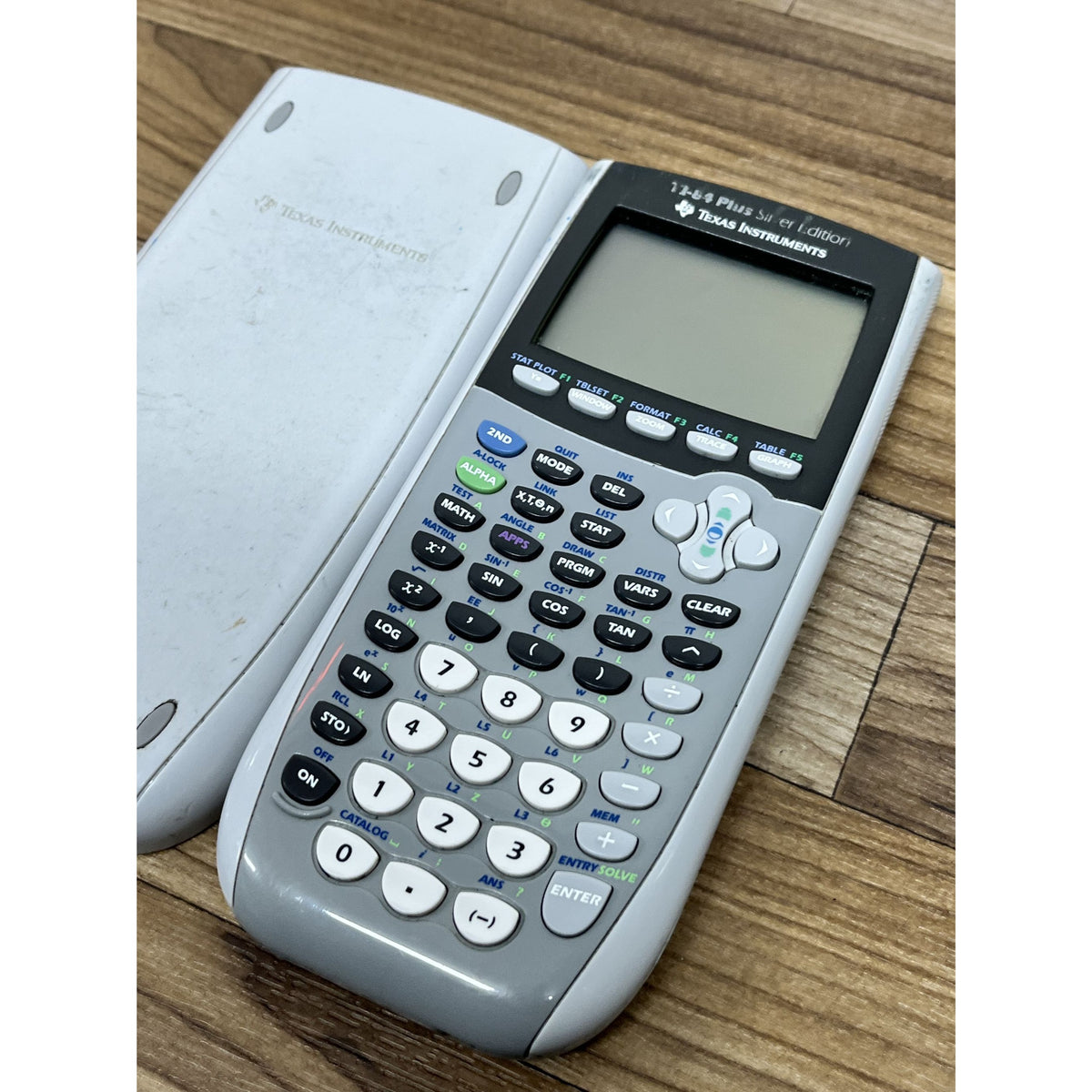 Texas Instruments TI-84 Plus Silver Edition Silver Graphing Calculator W/ Cover